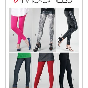 May include: A sewing pattern for leggings with six different styles. The pattern includes a black and white patterned legging, a red legging, a black legging, a denim legging, a pink legging, and a sparkly legging. The pattern is labeled "Easy McCall's".