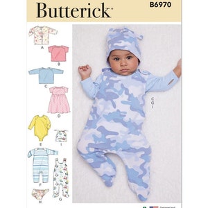 May include: A sewing pattern for baby clothes, including a hat, a dress, a onesie, and a pair of overalls. The pattern is from Butterick and has the number B6970 on it.