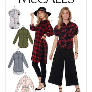 May include: McCall's sewing pattern M7472 for a shirt with various design options. The pattern includes a long-sleeved shirt with a side slit, a short-sleeved shirt, and a shirt with a tie belt. The pattern is shown on a model wearing a red and black plaid shirt, a black shirt with red floral print, and a green shirt.