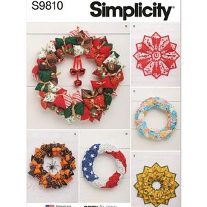 May include: A Simplicity sewing pattern for making six different wreaths. The pattern includes instructions for making a Christmas wreath, a Halloween wreath, an American flag wreath, a floral wreath, a sunflower wreath, and a red and white starburst wreath.