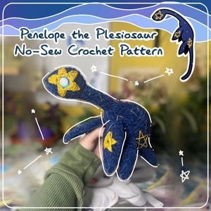 May include: A blue crocheted plesiosaur with yellow star accents and a yellow flower on its head. The crocheted toy is being held by a hand. The image includes the text "Penelope the Plesiosaur No-Sew Crochet Pattern".