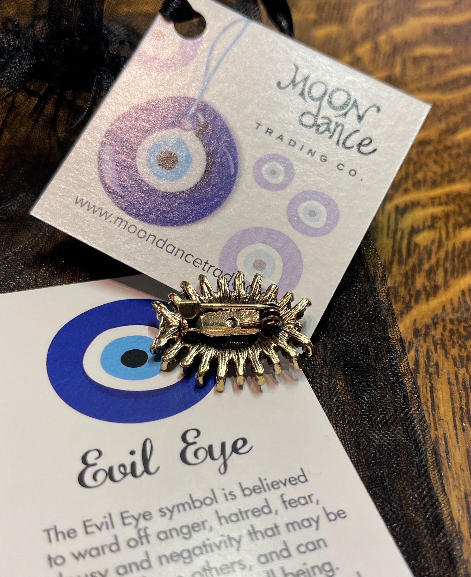 Evil eye deals lapel pin