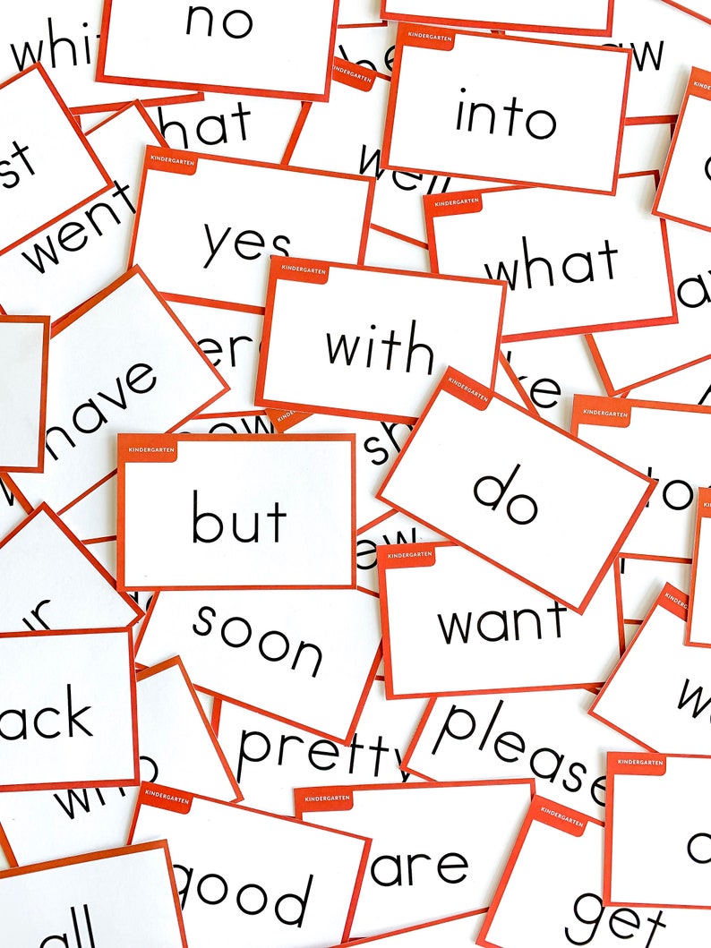May include: A collection of white flash cards with orange borders and black text. The words on the cards include "what", "yes", "no", "into", "with", "but", "soon", "pretty", "please", "want", "do", "have", "went", "hat", "good", "are", "get", "all", "ack".