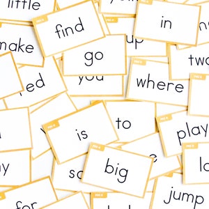 May include: A collection of white cards with black text, each card has a different word on it. The words include: funny, here, not, little, run, yellow, see, make, find, in, go, you, where, is, to, play, for, big, jump, come, help, and can.