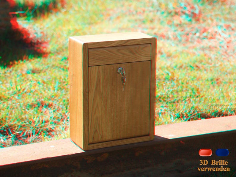 May include: A wooden box with a drawer and a keyhole. The box is light brown and has a wood grain pattern. The box is sitting on a wooden surface.