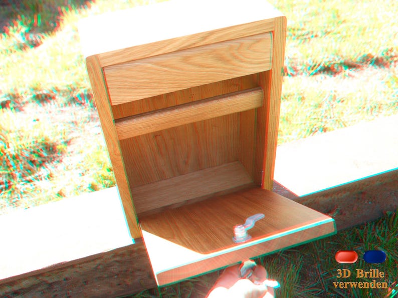 May include: A wooden box with a drawer and a shelf. The box is made of light wood and has a natural finish. The drawer is open and the shelf is empty.