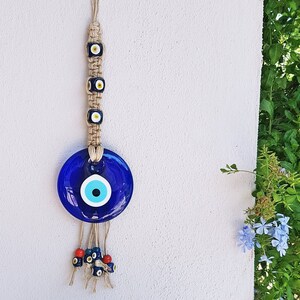 Ojo de cristal tejido con cuerda tejida para colgar en la pared, regalo personalizado, letra manuscrita vintage, liquidación final. Precio: 2 USD.