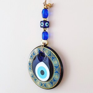 Decoración de pared con diseño de ojo malvado para proteger el hogar, con letra manuscrita vintage, centro de cristal y base de ojo malvado, 11 cm (4,3 pulgadas)