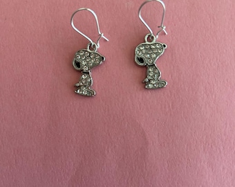 Snoopy from Peanuts licensed cartoon character cz “bling” earrings on hook wires.
