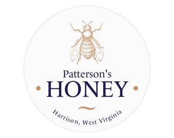 May include: A white round label with a brown line drawing of a bee. The text "Patterson's HONEY" is in navy blue with brown hexagon shapes on either side. The text "Harrison, West Virginia" is in navy blue below the honey text.