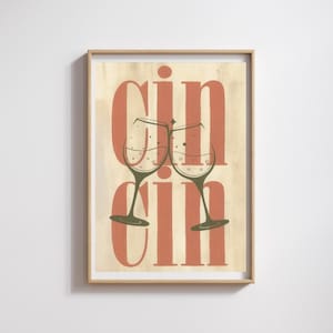 Puede incluir: Impresión artística enmarcada con la palabra "CIN CIN" en letras color coral y dos copas de vino brindando. El fondo es de color beige claro con un aspecto texturizado. Las copas de vino son de color verde oliva.