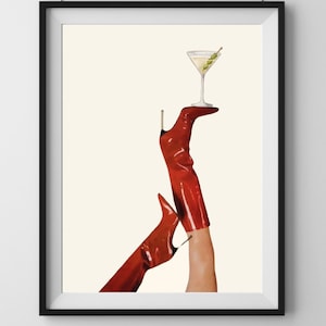 May include: A pair of red high-heeled boots with a martini glass balanced on top of one of the boots.