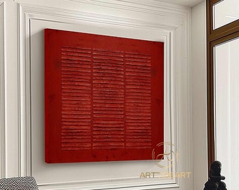 May include: A large abstract painting with a red background and horizontal lines. The painting is hanging on a white wall in a modern living room.