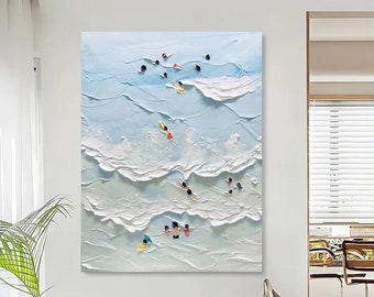 May include: A textured painting of a blue ocean with white waves and small figures of people swimming and surfing. The painting is on a white background.