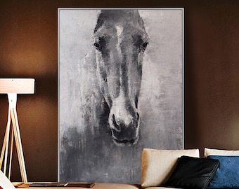 May include: A large, framed canvas art piece featuring a grayscale painting of a horse's head. The artwork uses textured brushstrokes to create a sense of depth and movement. The horse's face is the focal point, with its eyes and muzzle clearly defined.