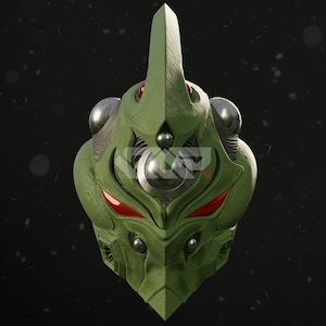 Puede incluir: Una máscara futurista verde detallada con un cuerno prominente y acentos de ojos rojos. La máscara presenta esferas plateadas metálicas y detalles mecánicos intrincados, lo que sugiere un tema de ciencia ficción o fantasía. El diseño es simétrico y estilizado.