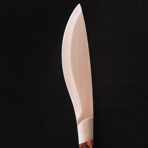 May include: A silver knife with a curved blade and a brown wooden handle with dark brown and red wood grain.