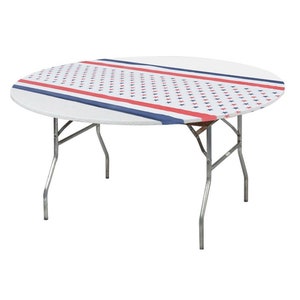 May include: A white round table with a red, white, and blue patterned tablecloth. The tablecloth has a red and blue stripe design with a pattern of small stars.