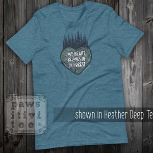 May include: A teal blue t-shirt with a tree-shaped heart graphic and the text "My heart belongs in the forest".