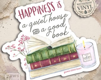May include: A waterproof vinyl sticker featuring a stack of three books, one open, with a pink candle and pink flowers. The text reads: HAPPINESS is a quiet house AND a good book. The sticker includes the brand name paws-itiv-tee at the bottom.