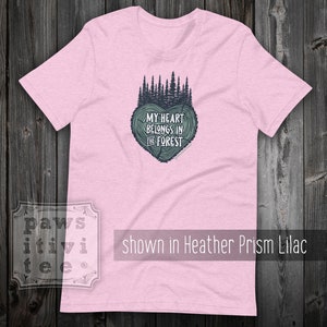 May include: Pink t-shirt with a green tree design and the text "My heart belongs in the forest".