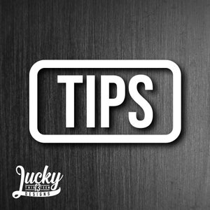 May include: White rectangular sign with a thick white border and the word "TIPS" in bold white letters.