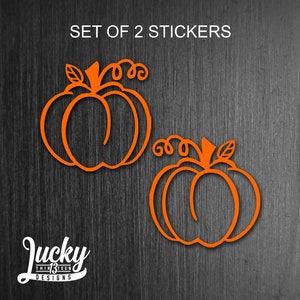 May include: Set of two orange pumpkin stickers. The pumpkins are outlined in a simple, stylized design with a stem and leaf.