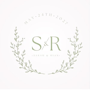 May include: A wedding invitation with a green floral wreath and the text "MAY 24TH 2027" above the initials "S&R" and the text "SARAH & RYAN".