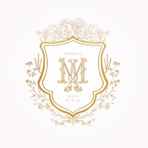 May include: A gold crest with a floral design and the initials "M" and "M" inside. The text "Michelle Allen 05.24.26" is below the initials.