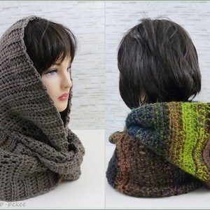 May include: A brown crocheted hooded cowl with a ribbed texture. The cowl is shown on a mannequin with short brown hair.