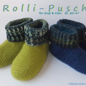 May include: Two pairs of crocheted slippers, one pair is green and the other is blue. The slippers have a contrasting coloured cuff. The text "Rolli-Pusch" is at the top of the image. The text "für Groß & Klein Gr. 20-47" is below the title. The text "240 Häkelanleitung im pdf-Format" is at the bottom of the image.