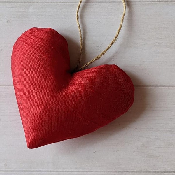 Single Red Silky Heart, Soft-stuffed, with or without twine hanger. Perfect for Valentine's Day, Anniversary, or just to say I love you.