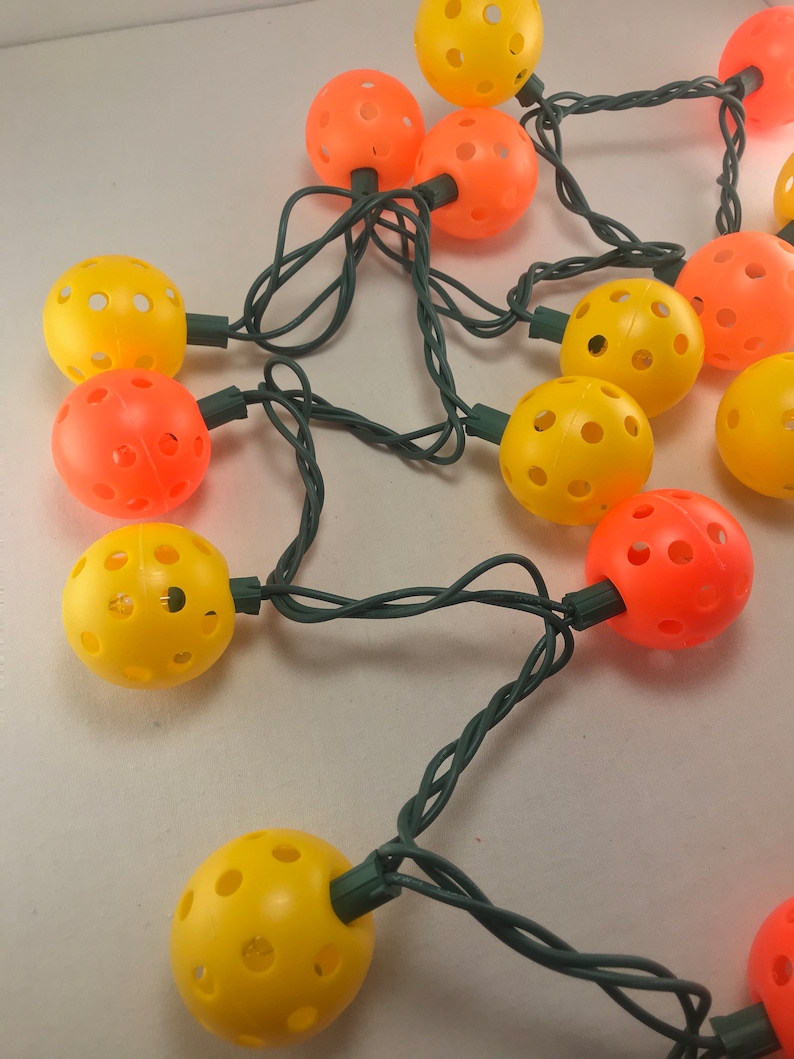 Fall color string lights with pickle balls.. Pickleball love.. Mini Pickleball String lights.. Mini pickleballs Fun pickleball items..
