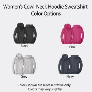 May include: Cowl-neck hoodie sweatshirt color options featuring text: Women's Cowl-Neck Hoodie Sweatshirt Color Options. Displays black, pink, grey, and navy hoodies, each shown from front and back views with drawstrings and front pockets. Text: Colors shown are representative only. Colors may vary slightly.