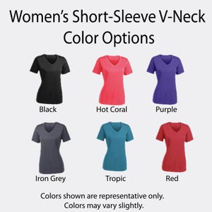 May include: A display of six short-sleeve V-neck t-shirts in various colors: black, hot coral, purple, iron grey, tropic, and red. The text "Women's Short-Sleeve V-Neck Color Options" is at the top. The bottom text says "Colors shown are representative only. Colors may vary slightly."