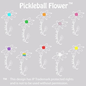 May include: A gray background features a pattern of white daisy-like flowers. Each flower has a colorful center and the word "pickleball" written on the stem. The text "Pickleball Flower" is at the top. The design is trademarked.