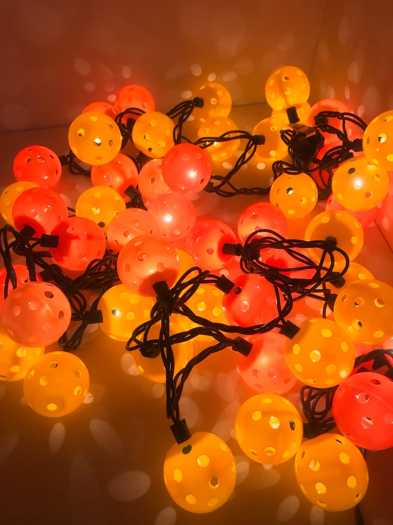 Fall color string lights with pickle balls.. Pickleball love.. Mini Pickleball String lights.. Mini pickleballs Fun pickleball items..