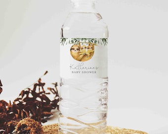 May include: Water bottle label with a sloth family design. The label is white with green leaves and the text "Katherine's Baby Shower".