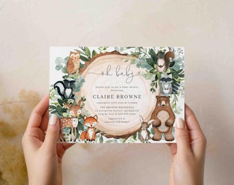 May include: A baby shower invitation featuring woodland animals like a bear, fox, and owl, surrounding a wooden circle. The invitation includes the text "oh baby" and details for Claire Browne's baby shower.