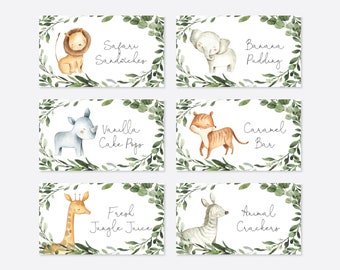 May include: Six printable food labels featuring jungle animals and greenery. The labels read: Safari Sandwiches, Banana Pudding, Vanilla Cake Pops, Caramel Bar, Fresh Jungle Juice, and Animal Crackers.