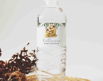 May include: Water bottle label with a watercolor illustration of a sloth family with green leaves. The label says "Katherine's Baby Shower".