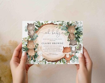May include: A baby shower invitation featuring woodland animals like bears, a moose, a rabbit, a fox, and a raccoon, surrounding a wood slice. The invitation includes the text "oh baby" and details for Claire Browne's baby shower.