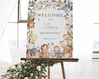 May include: Welcome to Chloe's 3rd Birthday party sign with a watercolor illustration of a woodland scene with animals and characters. The sign is on an easel.