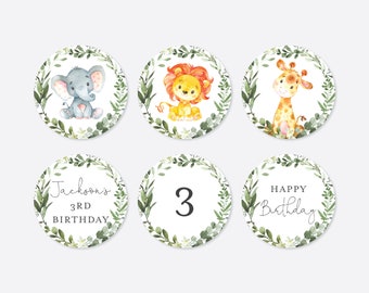 May include: Six round, white, green, and brown stickers with a leafy border. The stickers feature a giraffe, lion, elephant, the number 3, the text "Jackson's 3rd Birthday", and the text "Happy Birthday".