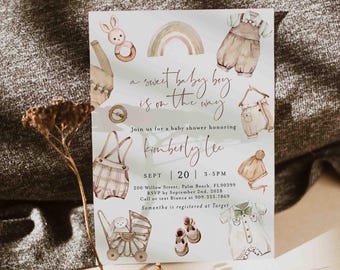 May include: Baby shower invitation with watercolor illustrations of baby clothes, a rainbow, and a bunny. The text reads "a sweet baby boy is on the way" and invites guests to celebrate Kimberly Lee's baby shower on September 20th.
