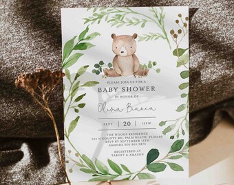 May include: A baby shower invitation with a watercolor illustration of a brown bear surrounded by green leaves. The invitation text reads "Please join us for a baby shower in honor of Olivia Bianca, Sept 20, 12PM, The Woods Residence, 144 N County Rd, Palm Beach, FL33480, RSVP by September 15th, Amanda 360.965.9870, Registered at Target & Amazon."