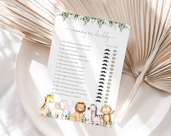 Könnte beinhalten: Eine Babyparty-Spielkarte mit dem Text "Mommy or Daddy" und einer Liste von Fragen. Die Karte zeigt Illustrationen von Safaritieren und einen Bereich, in dem man entweder einen Schnurrbart oder ein Lippenpaar für jede Frage einkreisen kann.