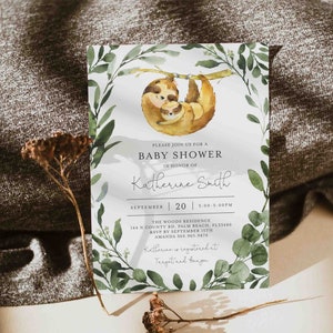 May include: A baby shower invitation with a watercolor illustration of two sloths on a branch. The invitation is for Katherine Smith and is set for September 20th from 3:00 to 5:00 PM at The Woods Residence. RSVP by September 15th to Amanda at 360.965.9870. Katherine is registered at Target and Amazon.