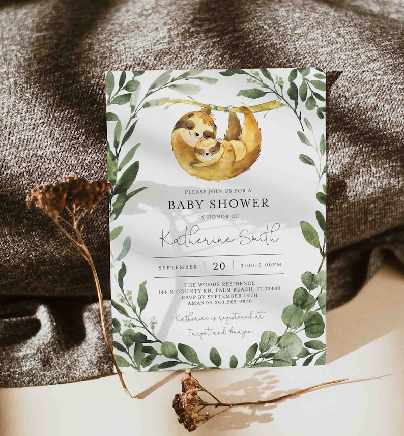 May include: A baby shower invitation with a watercolor illustration of two sloths on a branch. The invitation is for Katherine Smith and is set for September 20th from 3:00 to 5:00 PM at The Woods Residence. RSVP by September 15th to Amanda at 360.965.9870. Katherine is registered at Target and Amazon.