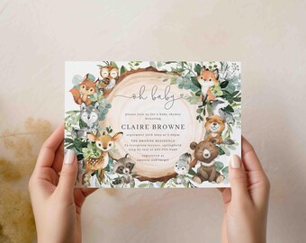 May include: A baby shower invitation featuring woodland animals like a fox, deer, and bear, surrounding a wooden circle. The text "oh baby" is written in cursive, with details for Claire Browne's shower.